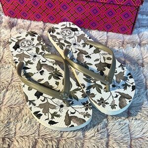 TORY BURCH Flip Flops  size 9
White With Floral Pattern